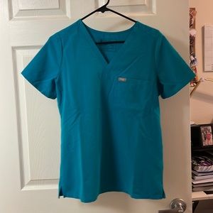 Figs one pocket scrub top in a size small in the color teal! Gently used!